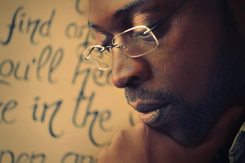 Close-up portrait of Jay C. Patsson reading